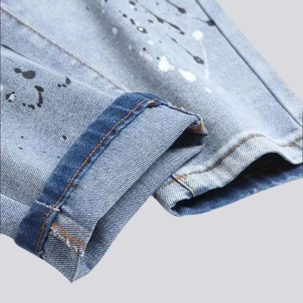 Paint-splattered men's patchwork jeans